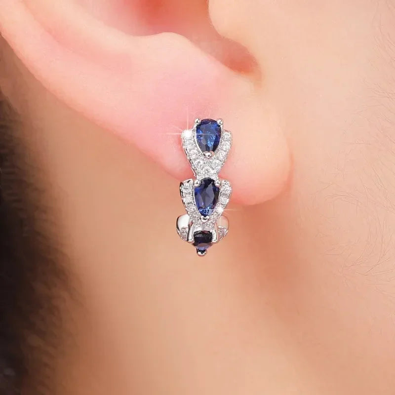 Aretes con el escudo real de zafiro | Oro blanco