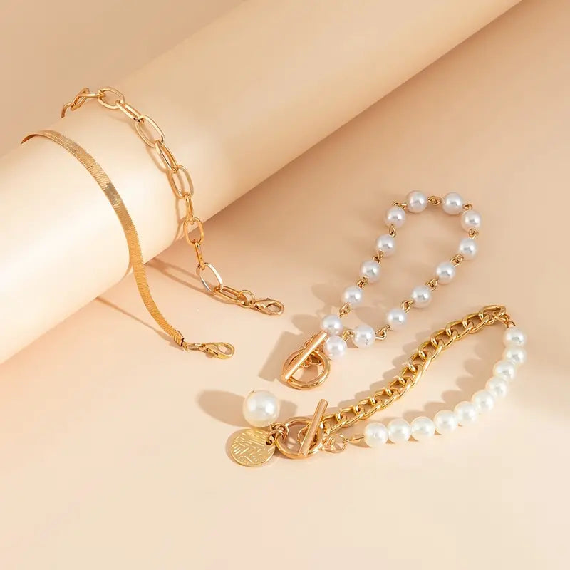 Elegante conjunto de 4 pulseras doradas: serpiente, perlas y eslabones | Oro