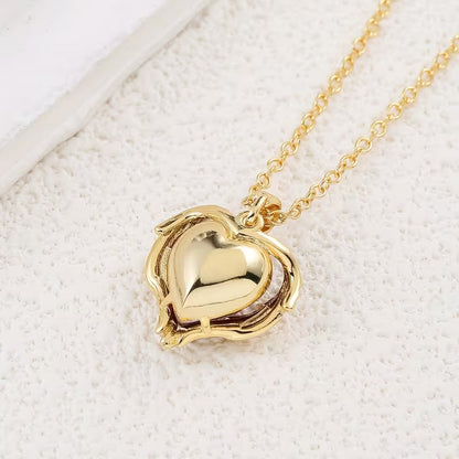 Collar Abrazo de Ángel con corazón de rubí | Oro