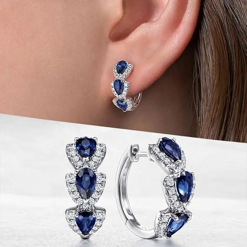 Aretes con el escudo real de zafiro | Oro blanco