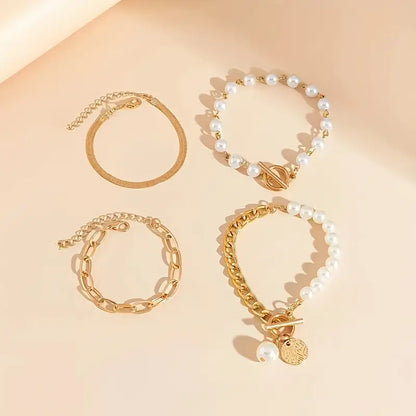 Elegante conjunto de 4 pulseras doradas: serpiente, perlas y eslabones | Oro