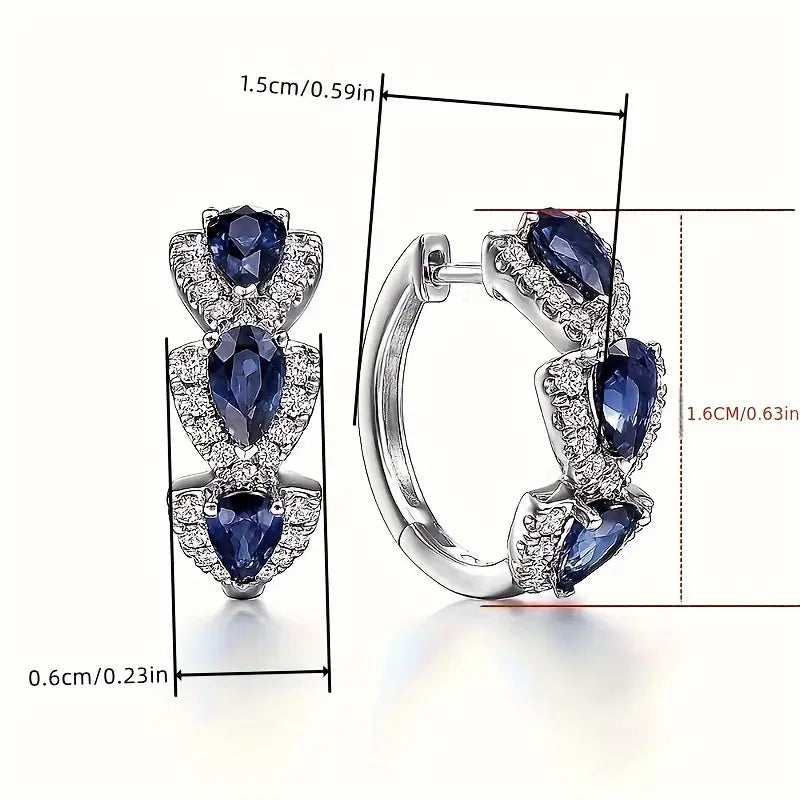 Aretes con el escudo real de zafiro | Oro blanco