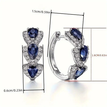 Aretes con el escudo real de zafiro | Oro blanco