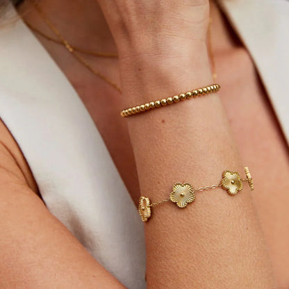 Pulsera con dije Florielle Bloom | Oro
