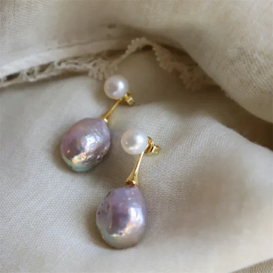 Exquisitos aretes de perlas lilas | Oro